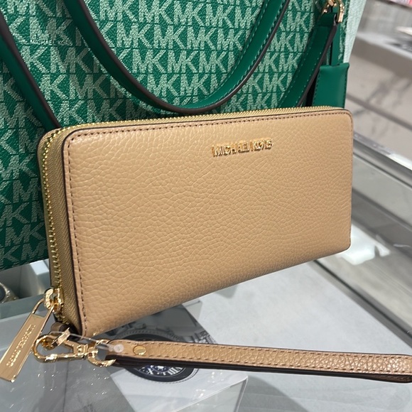 Michael Kors Handbags - MICHAEL KORS LARGE TRAVEL CONTINENTAL WRISTLET WALLET PHONEHOLDER  
CAMEL